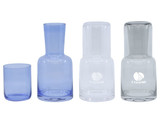 A drink bottle and tumbler set featuring two glass carafes in clear and light blue, alongside matching tumblers.
