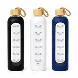 A drink bottle set featuring black, white, and navy options with wooden lids and measurement markings.