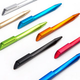 A collection of plastic pens in various colours: blue, green, gold, orange, black, and red, arranged neatly.