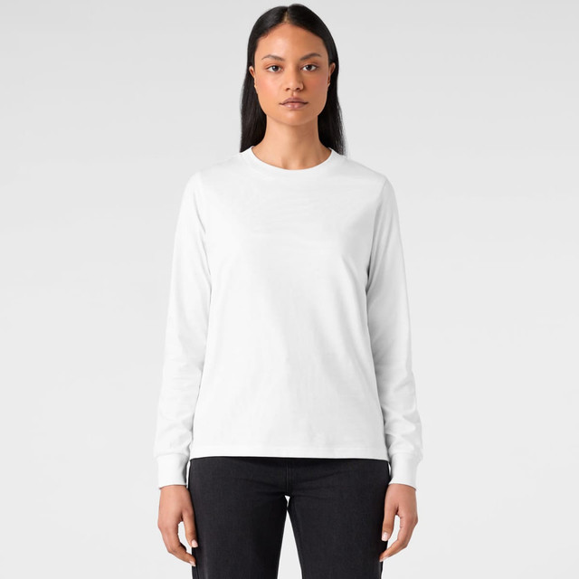A long-sleeve white T-shirt featuring a logo, styled with a simple design and paired with black jeans.