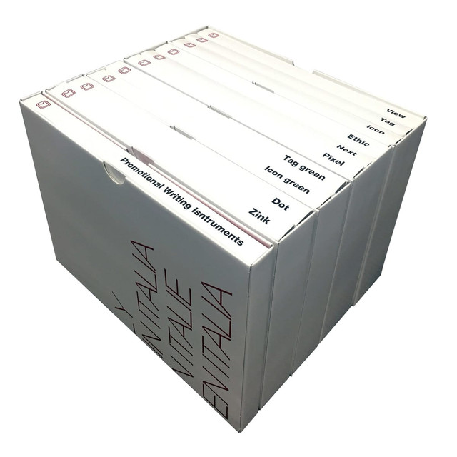 A white box containing various writing instruments in multiple colours, with a branding logo on the side.