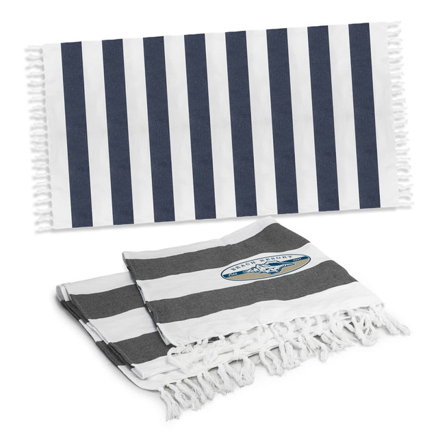 Striped cotton towels in navy blue and white, featuring fringe edges and a logo, displayed together.