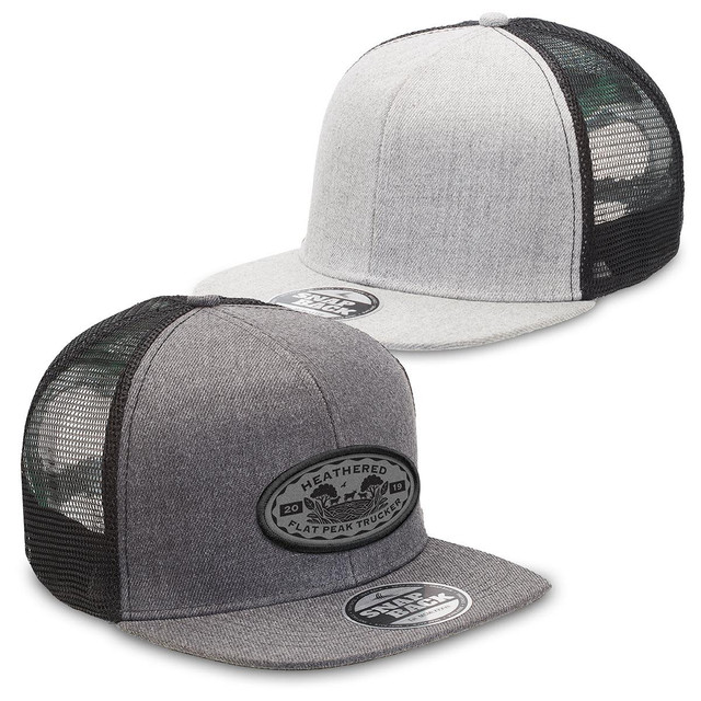 A grey and black heathered flat peak trucker cap featuring a logo on the front and mesh panels on the sides.