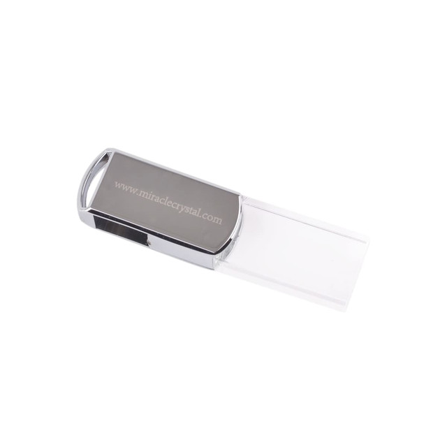 A sleek silver and clear swivel crystal flash drive with a branding logo and a transparent cover.