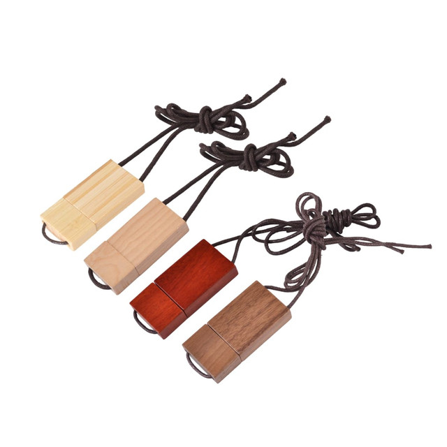 Four wooden string flash drives in light wood, dark wood, and red wood, each with a tied string.