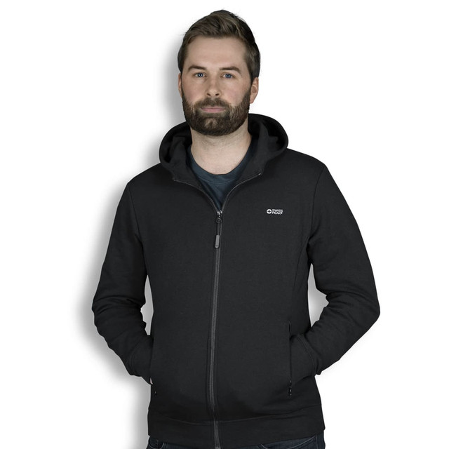A black zip-up hoodie worn by a man with a beard, featuring a hood and a small logo.