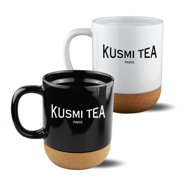 A mug set featuring black and white mugs with cork bases and branding.