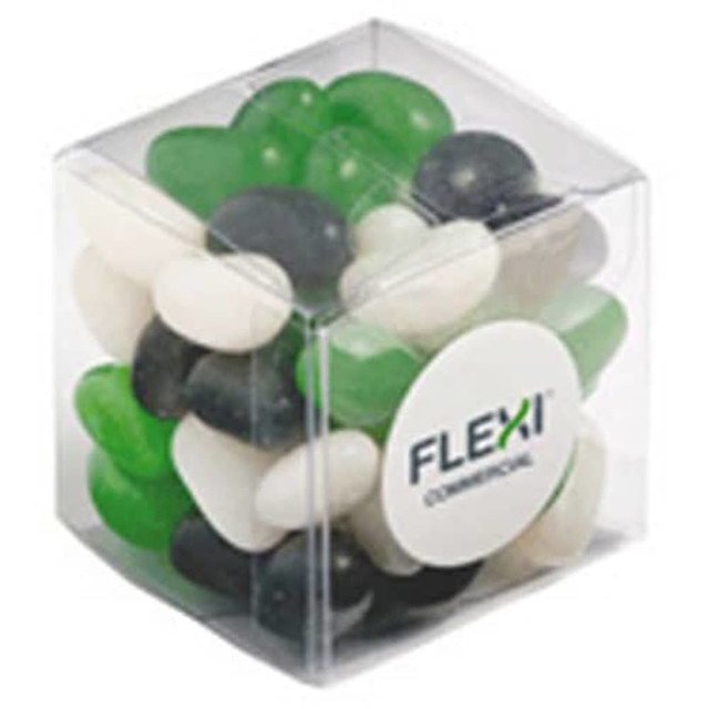 A cube container filled with green, black, and white jelly beans. The container has a logo on it.