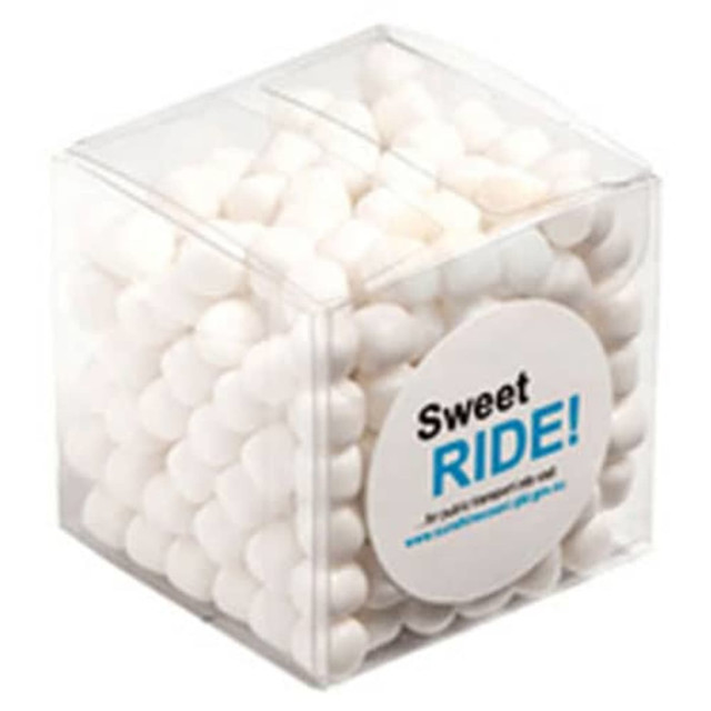 A clear cube filled with white chewy mints, featuring a circular logo.