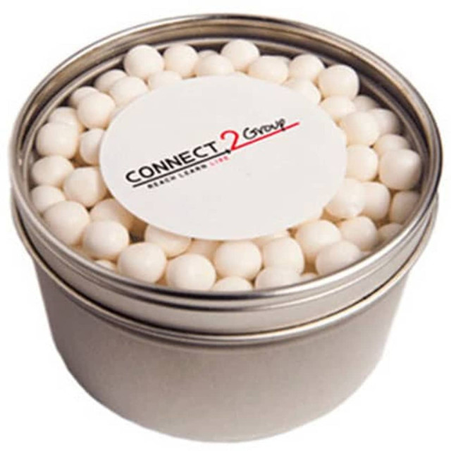 A small round silver tin filled with white mints, featuring a branded label on top.