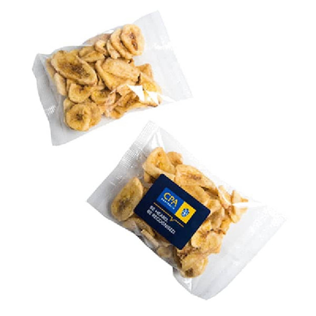 Two packets of banana chips, featuring light brown, crispy slices in a clear plastic packaging with a logo.