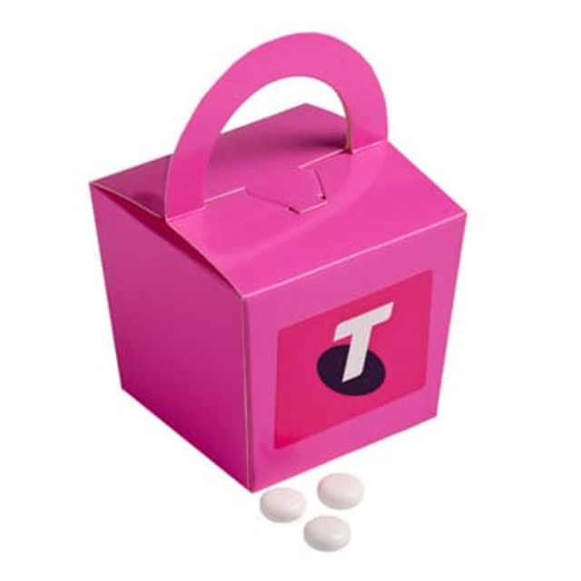 A pink noodle box with a handle containing white mints. The box features a logo on one side.