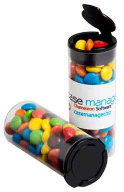 A transparent flip lid tube containing multicoloured M&Ms, with a black lid and a visible logo.
