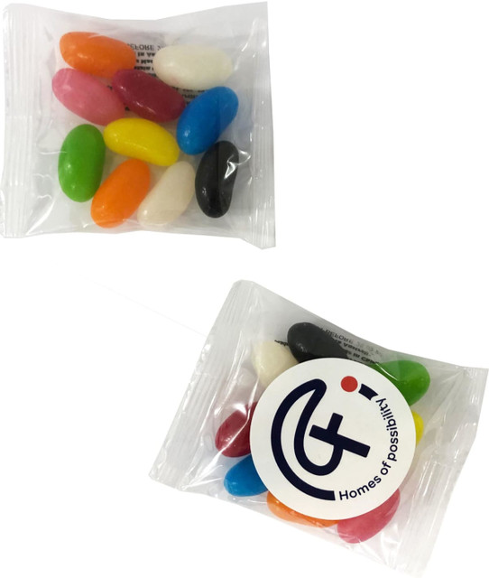 A clear bag containing an assortment of colourful jelly beans in various shades, alongside a branded logo.