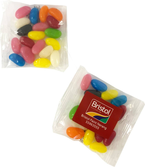 A packaging of assorted jelly beans in various colours, featuring a logo on one of the bags.