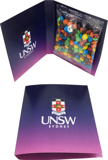 A gift card package featuring a clear bag of colourful M&M's neatly displayed inside a branded folder.