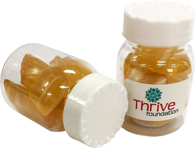 Two clear jars containing yellow eucalyptus lollies, featuring a white lid and a logo on the label.