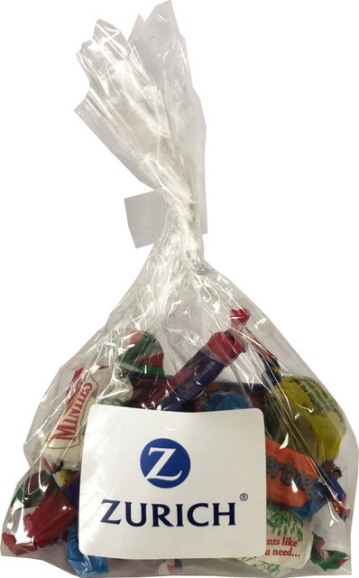 A clear bag containing a variety of mixed lollies in bright colours, with a logo on the front.
