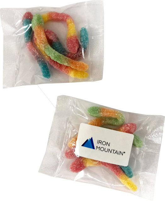 A clear packet containing assorted sour gummy worms in vibrant colours: red, yellow, green, and blue.