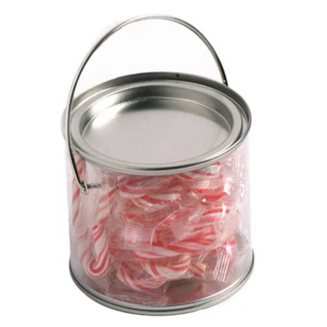 A medium clear PVC bucket filled with red and white striped candy canes, featuring a metal handle.
