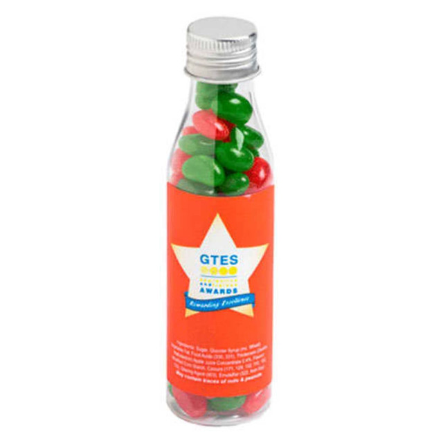 A drink bottle filled with red and green jelly beans, with a clear body and a silver cap.