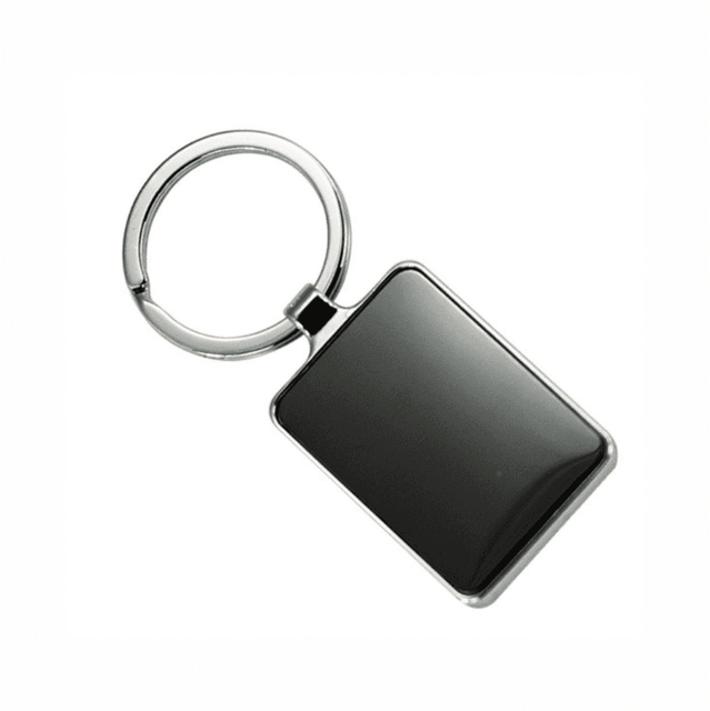 A keychain featuring a sleek rectangular metal pendant with a shiny black surface and a circular keyring.