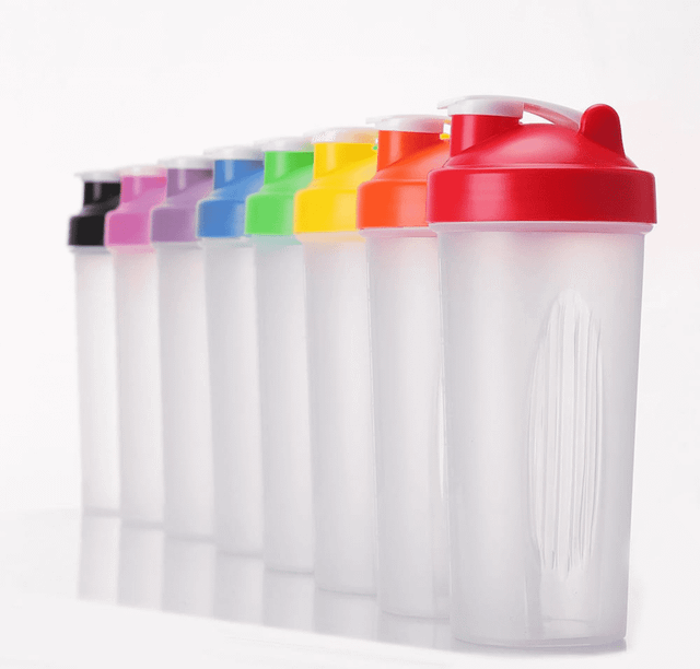 A drink bottle in various colours, featuring a flip-top lid and a visible mixing ball inside. It has a logo on the side.