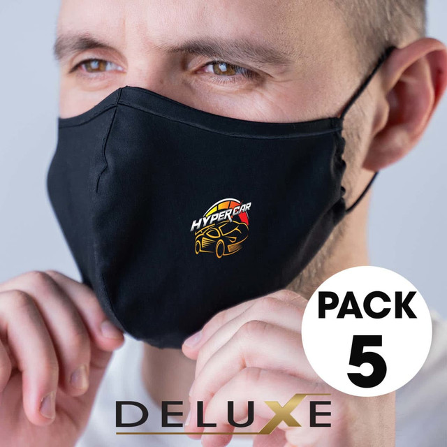 A set of five deluxe black face masks featuring a logo. The masks are worn by a person.