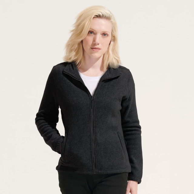 A black women's fleece jacket with a zip front and a collar, featuring a logo on the chest.