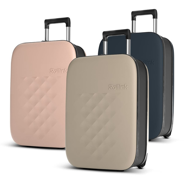 Three Rollink Flex Vega suitcases in pink, beige, and dark blue, featuring a branded logo and wheeled design.