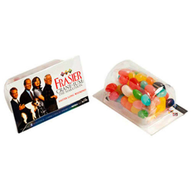 A clear container filled with assorted jelly beans in various colours, alongside a promotional card featuring branding.