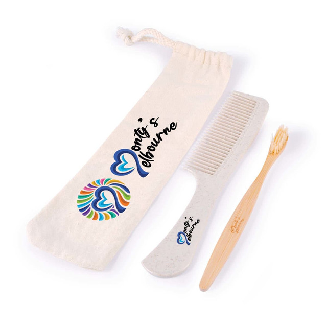 A toiletry pack containing a bamboo toothbrush, a comb, and a cotton pouch featuring a colorful heart graphic.