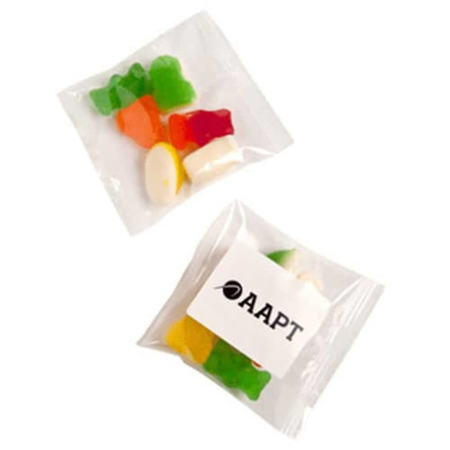 A clear bag containing mixed lollies in bright colours, featuring a branded sticker.