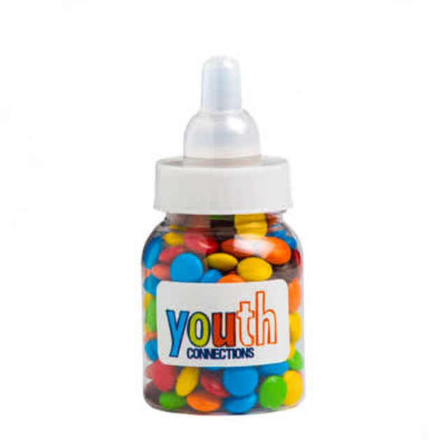 A drink bottle filled with colourful mini M&Ms in red, yellow, blue, and green. The bottle has a logo on it.