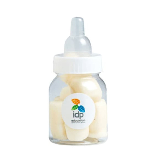 A drink bottle filled with white milk bottle-shaped confectionery, featuring a clear body and a white cap.