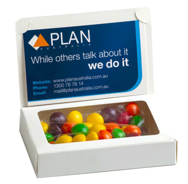 A box containing mixed Skittles in various colours, with a branding logo on the front.