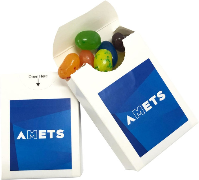 A flip lid cardboard box containing colourful jelly beans, featuring a branded logo on the exterior.
