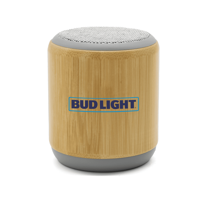 A bamboo Bluetooth speaker with a grey base and a branded logo on the front.