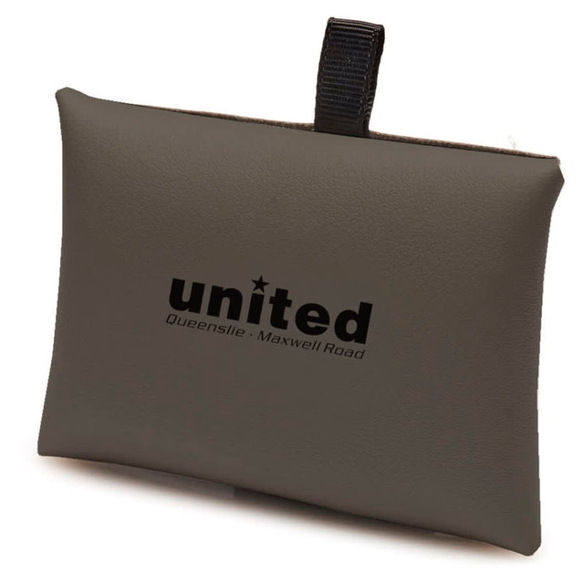 A green charging envelope with a logo, designed to hold multiple charging cables. Features a textured surface and a loop for carrying.