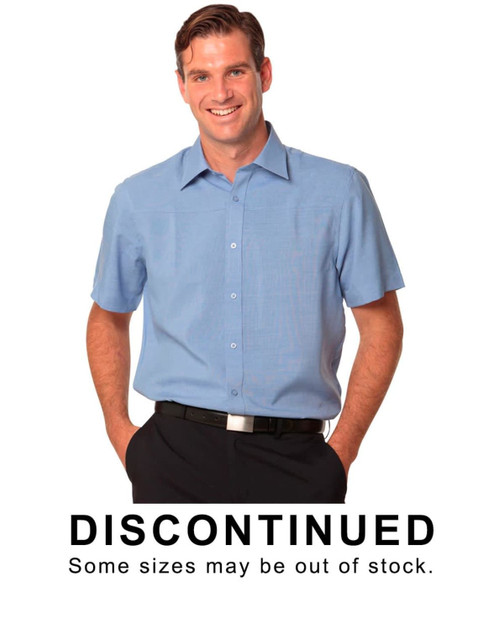 A light blue men's short sleeve shirt with a button-up design and a logo. The shirt has a relaxed fit.