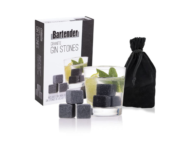 A set of six grey gin stones with a velvet bag and packaging, alongside a drink featuring mint and lime.