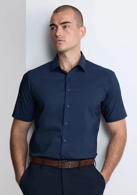 A classic fit short sleeve shirt in navy, featuring a button-up front and a subtle branding logo.