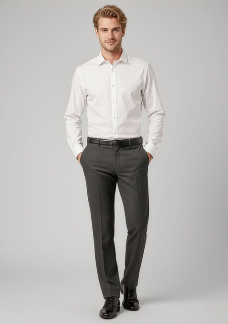 A man stands wearing a white shirt and grey classic flat pants, paired with a belt and black shoes. The outfit includes branding.