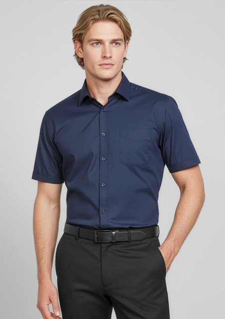 A button-up short sleeve shirt in navy blue, featuring a pocket and a branded logo.