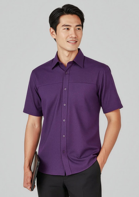 A plain short sleeve button-up shirt in purple, featuring a logo and a sleek, casual design.