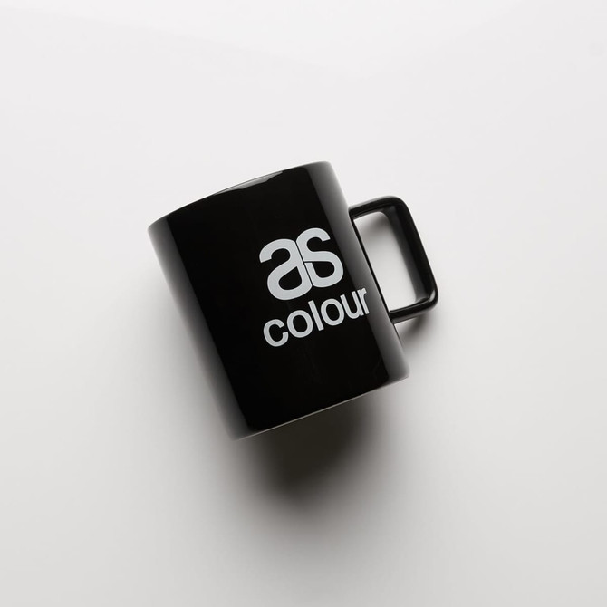 A black coffee mug with a handle featuring a logo. Simple and sleek design.