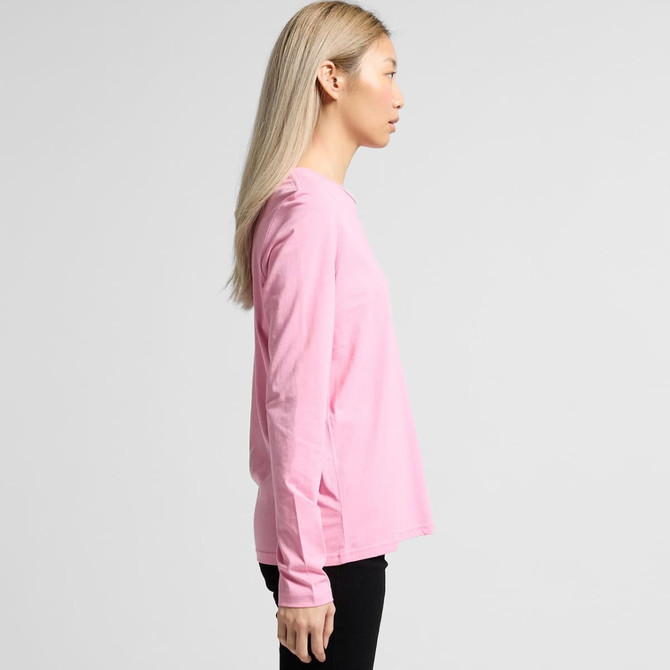 A long-sleeve T-shirt in pink with a simple design and a logo, displayed on a model from the side.