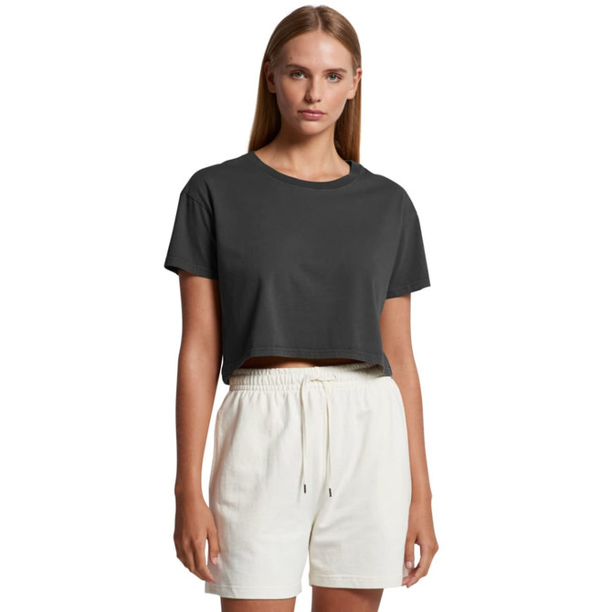 A cropped t-shirt in dark grey, paired with light-coloured shorts, featuring a simple design and a logo.