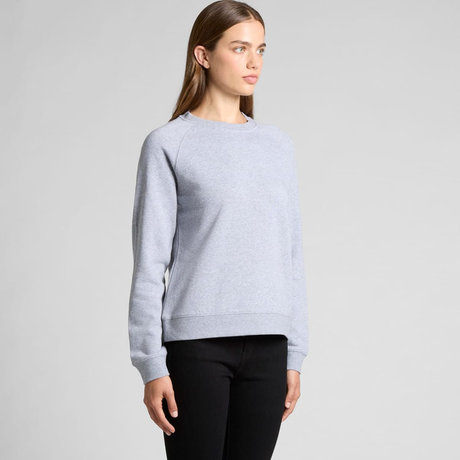 A light grey jumper with a relaxed fit, featuring long sleeves and a ribbed hem. The model stands against a plain background.