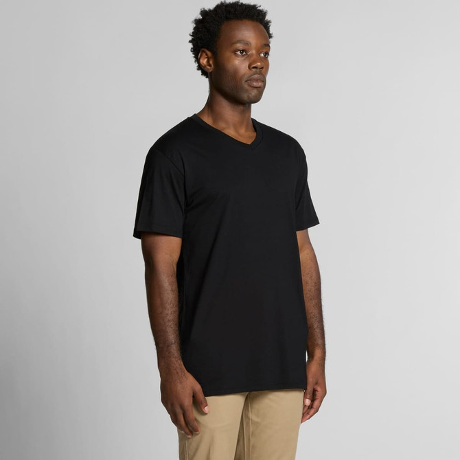 A black V-neck T-shirt displayed on a model, featuring short sleeves and a relaxed fit.